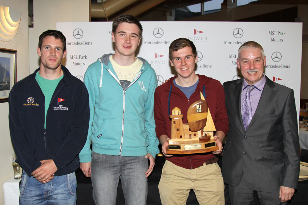 Gordon Stirling, Cian Manly and Harry Cronin collect the PAB Travel Trophy from MSL Park Motors Group Managing Director Brendan Grace