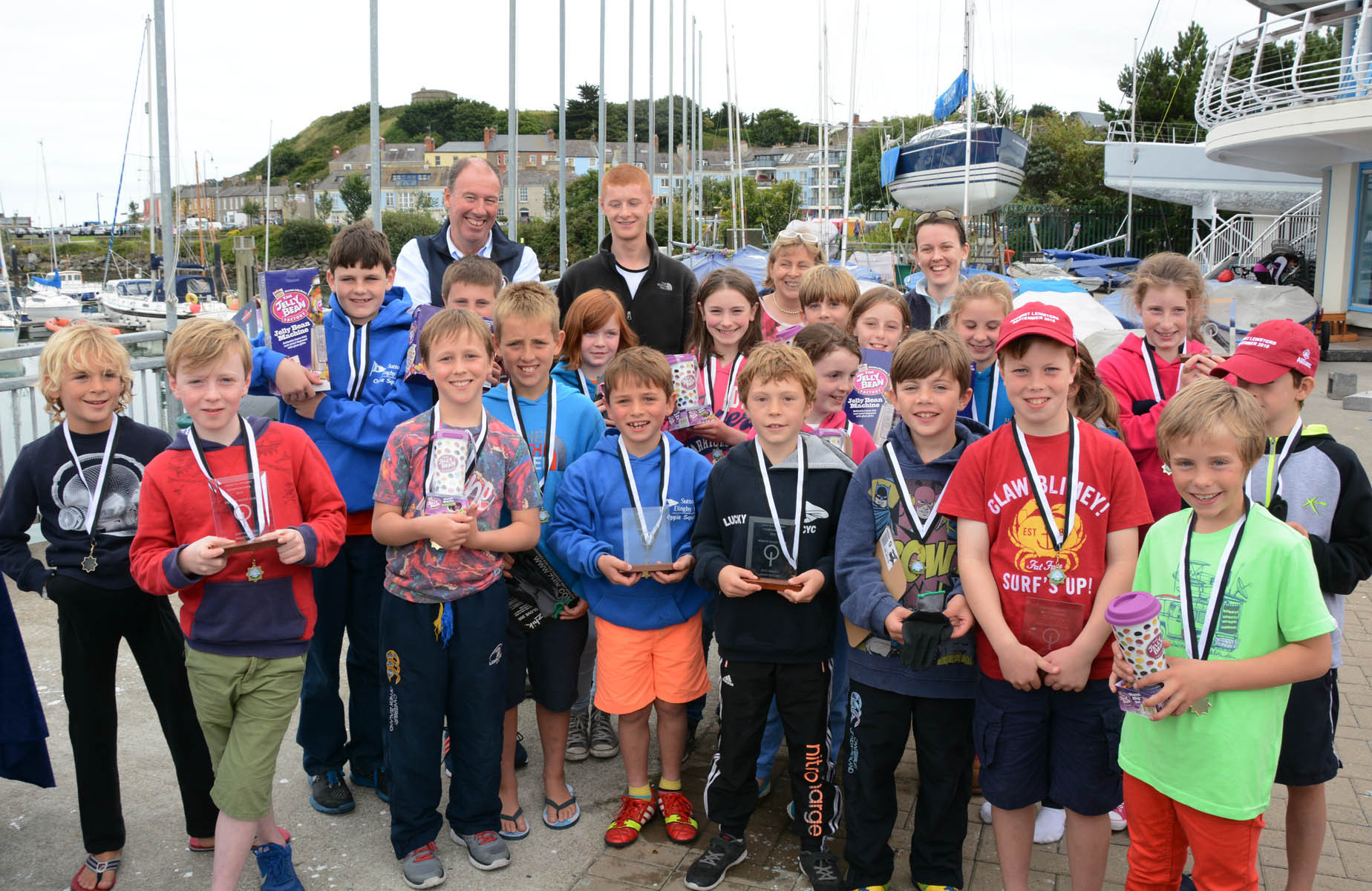 The Regatta Fleet prizewinners with (back row) Commodore Brian Turvey, coach Mark Condy and IODAI President Jill Sommerville