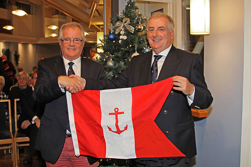 Berchmans Gannon presents incoming Commodore Joe McPeake with his flag