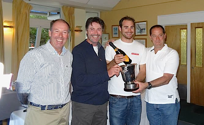 Commodore Brian Turvey presents Ian Sheridan and the 'Erica' team (Joss Walsh and Fred Connolly) with the Championship Handicap Trophy (absent: Paddy Cronin) 