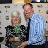 Rhianna Flannery collects the Lorna Townsend Trophy from Commodore Brian Turvey