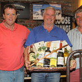 Colm Bermingham is presented with the Overall Prize by Barry Gibney and Dermot Skehan